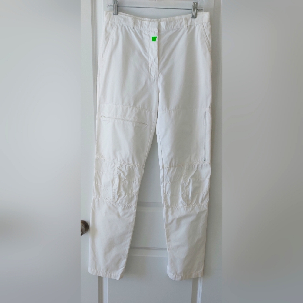 White pants with zippers and ruched knees